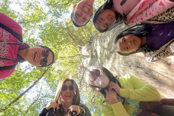 NDI's Catherine Leung in Hong Kong on a walk with her daughters and their friends