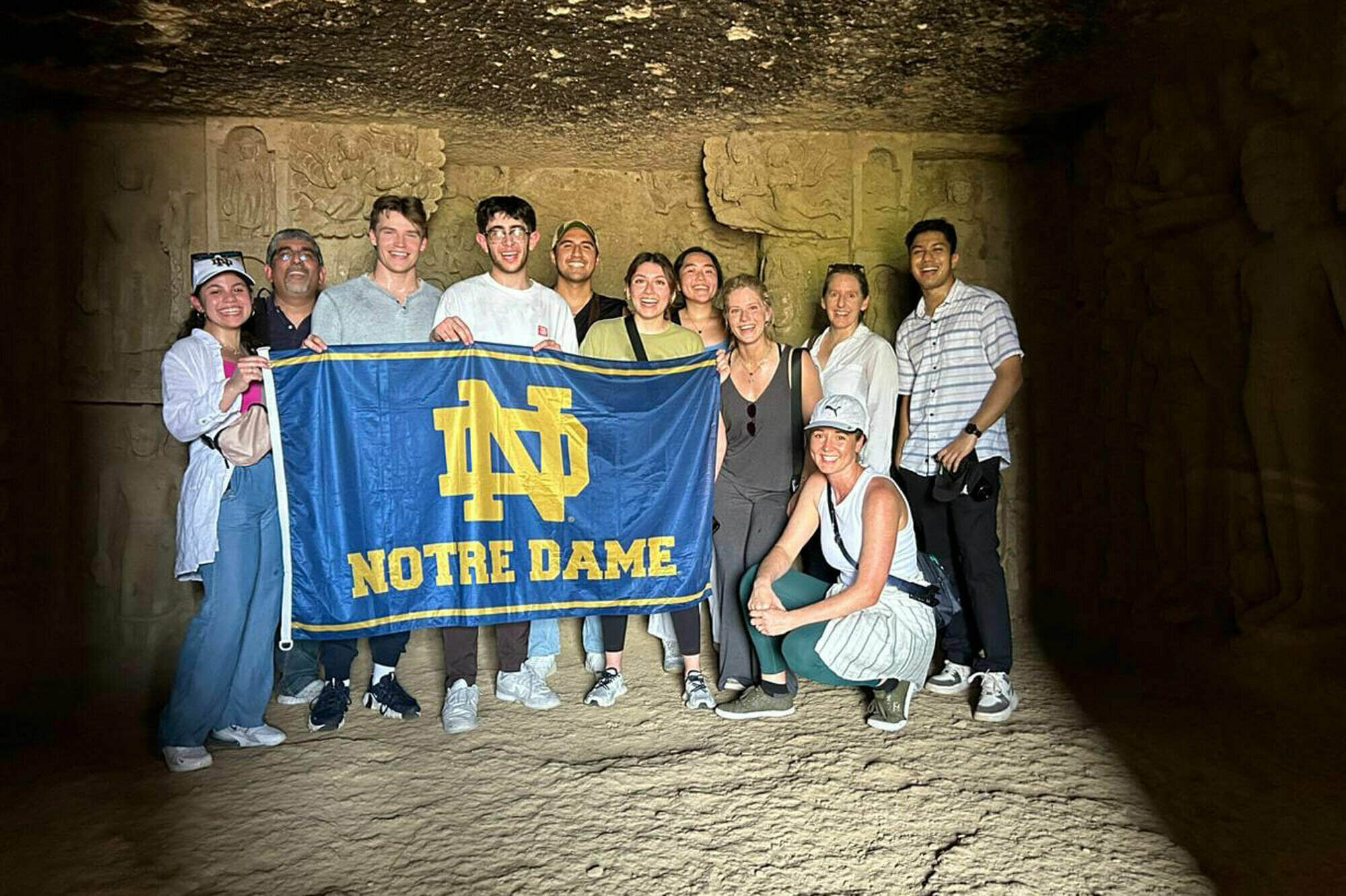 Repping ND at the top! The Notre Dame India Summer group braved the Mumbai heat, trekking through Sanjay Gandhi National Park to the 2400-year-old Kanheri Caves. Epic view from inside the highest cave.